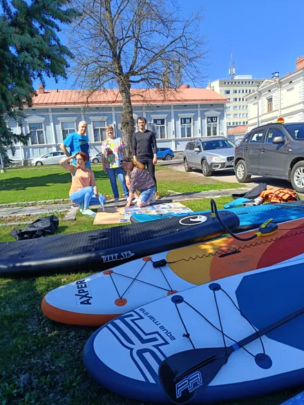SUP participants preparing for the start on the water