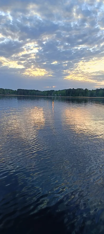 A calm, peaceful sunset over Lake Saimaa