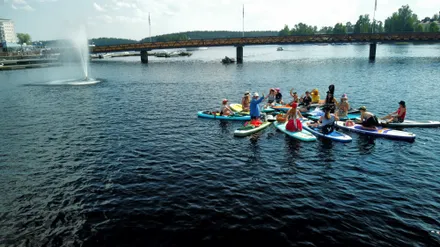 aerial group photo of festival participants on the water