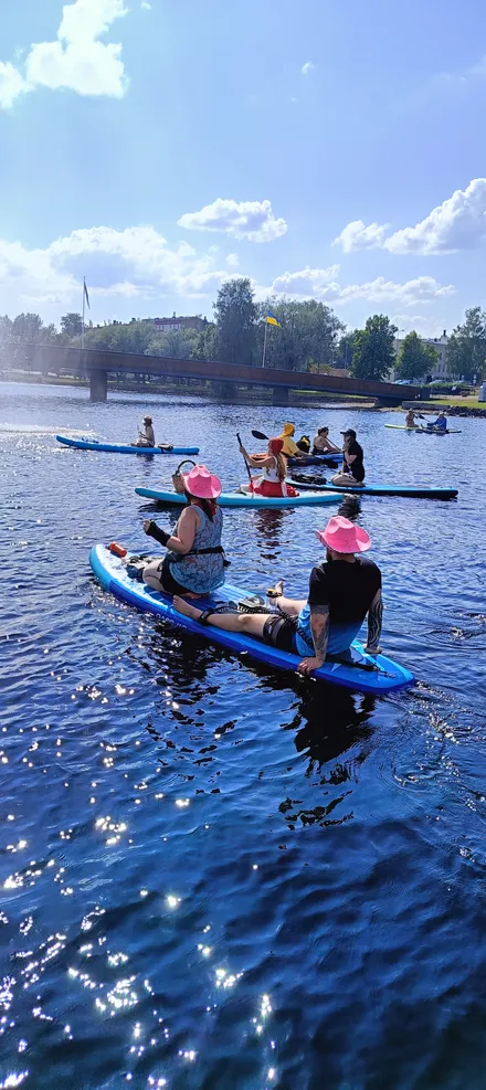 festival group near the Saimaa seal sculpture